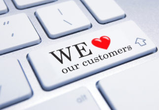 Une touche d'ordinateur "We love our customers"